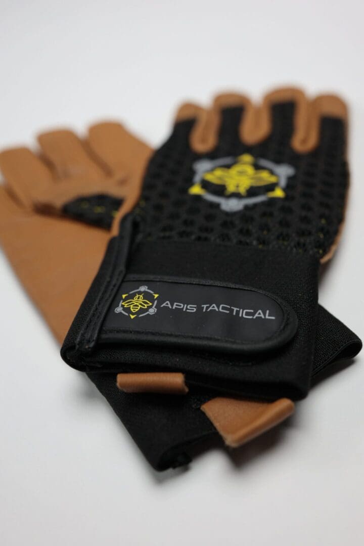 Tactical gloves with black and brown design.