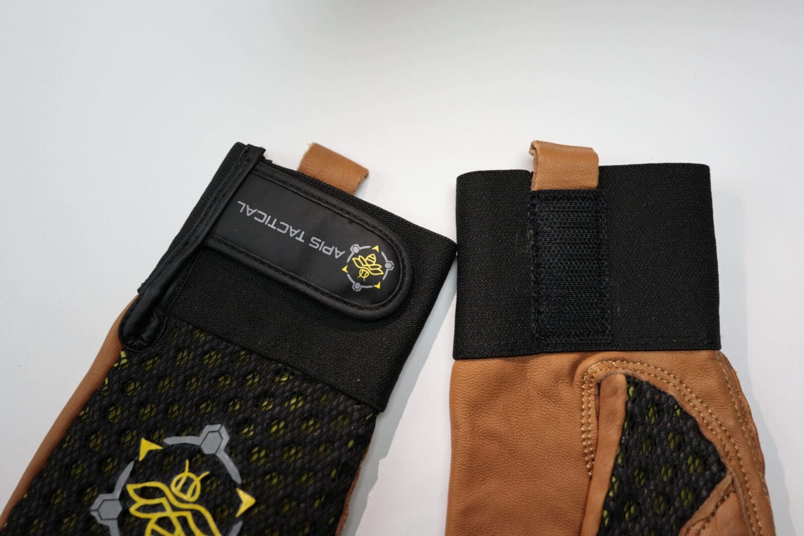 Tactical gloves with logo on display.