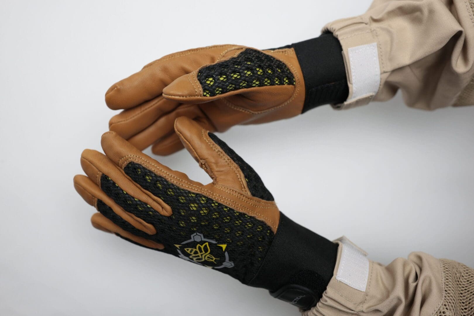 Protective gloves with black and brown design.